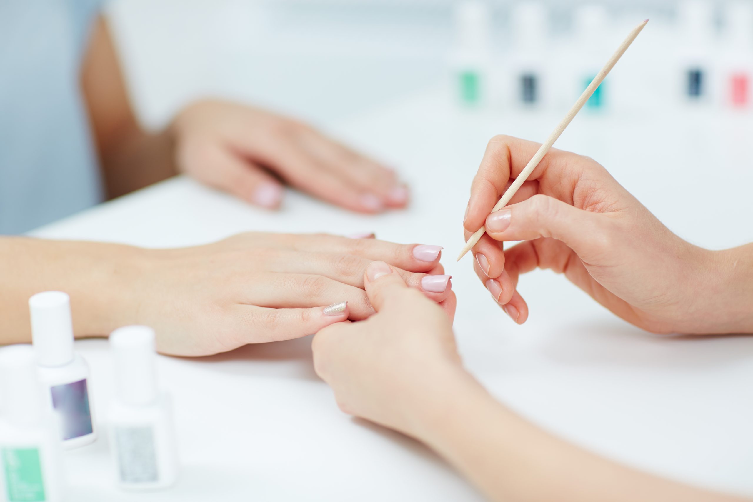 Woman hands receiving a manicure in beauty salon