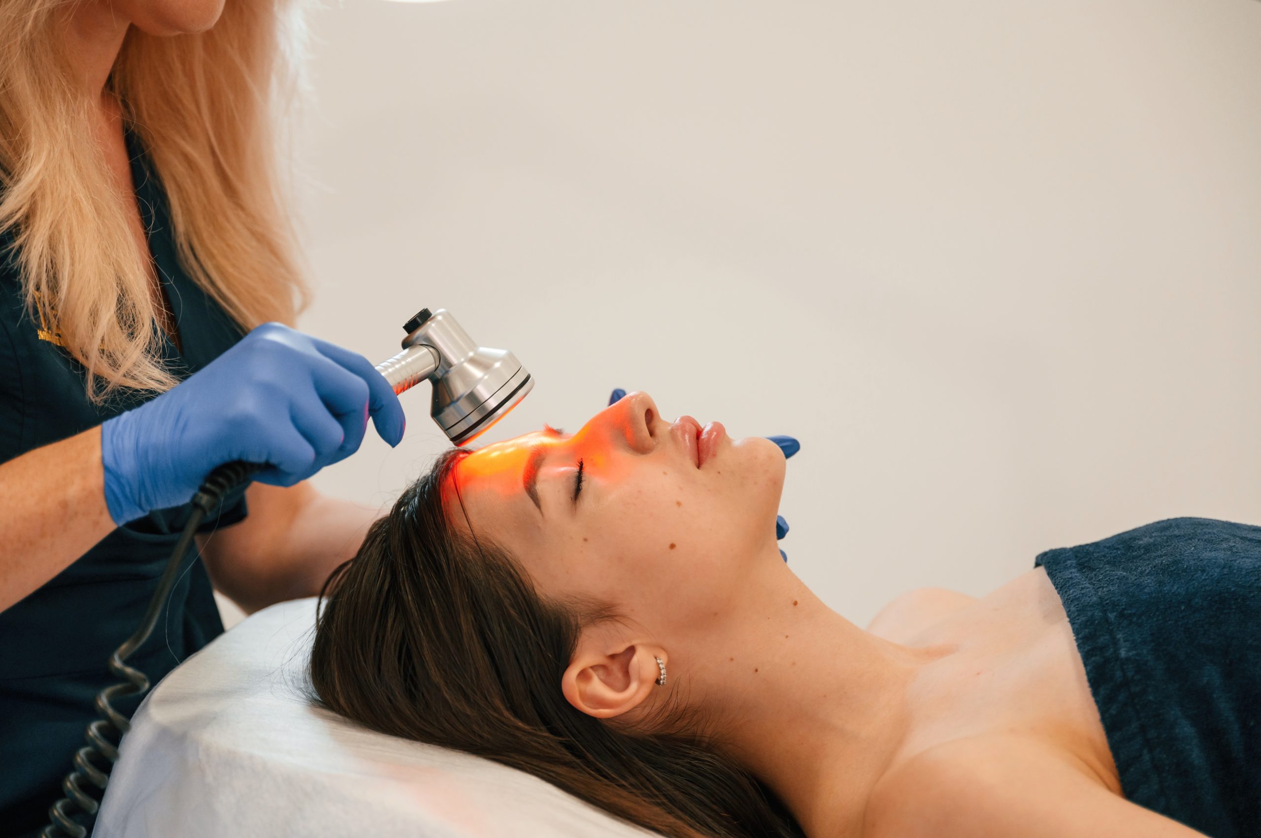 Cosmetologist does injection for lips augmentation. Women's cosmetology in the beauty salon.