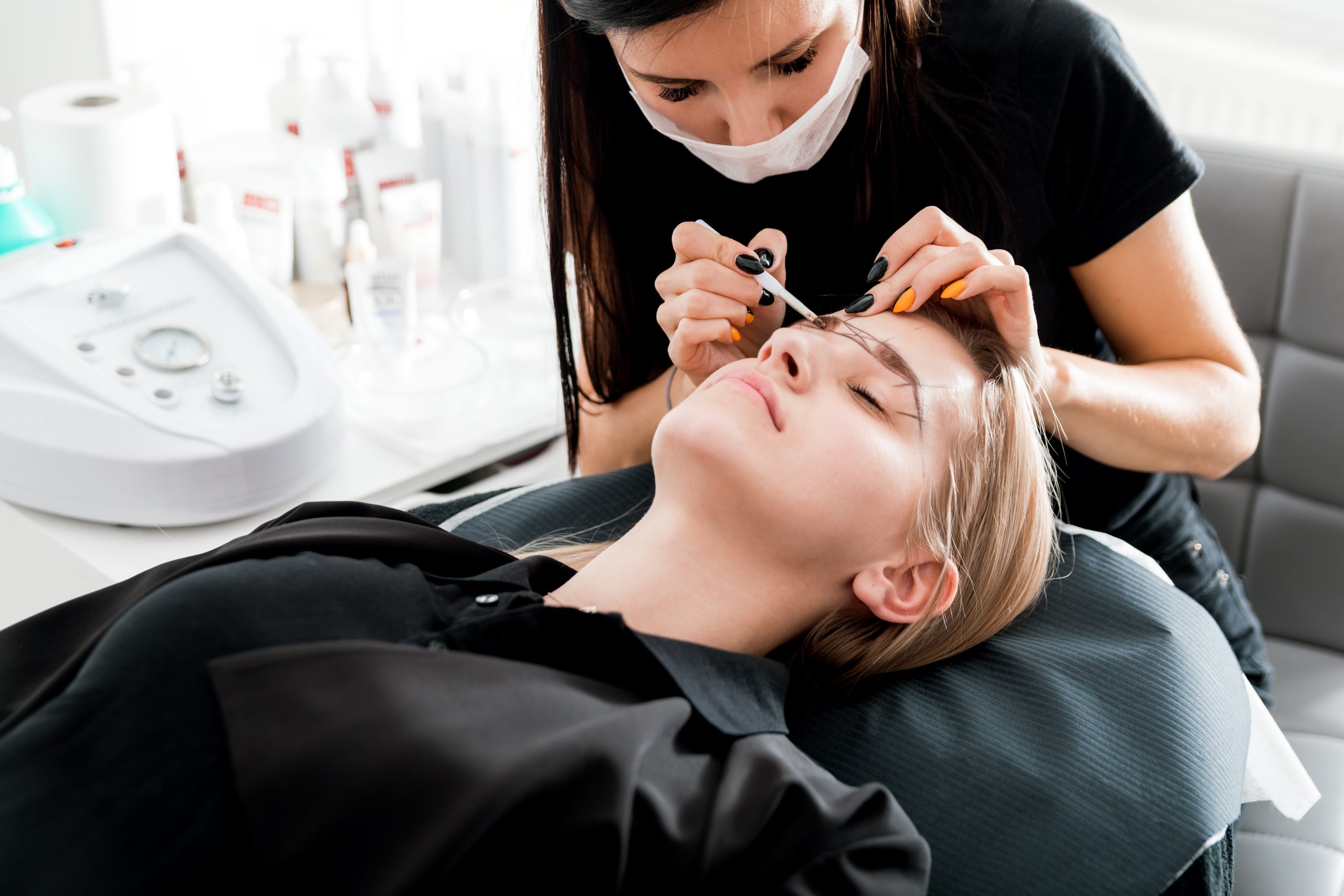 Permanent make up on eyebrows at beauty salon